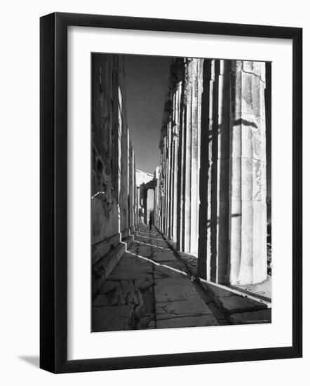 Man Walking Through the Remains of an Ancient Temple in Athens-Dmitri Kessel-Framed Photographic Print