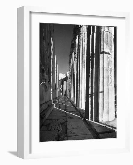 Man Walking Through the Remains of an Ancient Temple in Athens-Dmitri Kessel-Framed Photographic Print