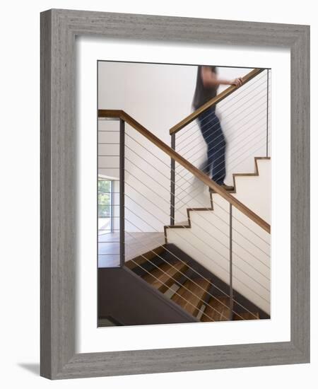 Man Walking Up Stairs in Apartment-John Edward Linden-Framed Photo