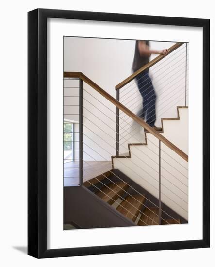 Man Walking Up Stairs in Apartment-John Edward Linden-Framed Photo