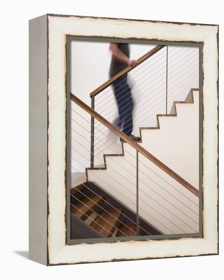 Man Walking Up Stairs in Apartment-John Edward Linden-Framed Stretched Canvas