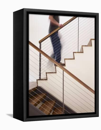 Man Walking Up Stairs in Apartment-John Edward Linden-Framed Stretched Canvas