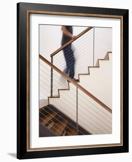 Man Walking Up Stairs in Apartment-John Edward Linden-Framed Photo