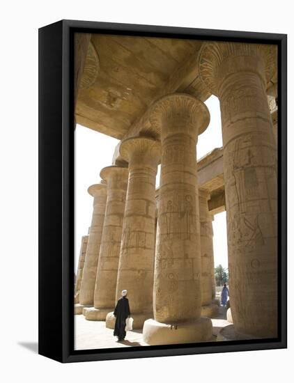 Man Walks Underneath the Giant Columns of the Hypostyle Hall in the Ramesseum, Luxor-Julian Love-Framed Premier Image Canvas