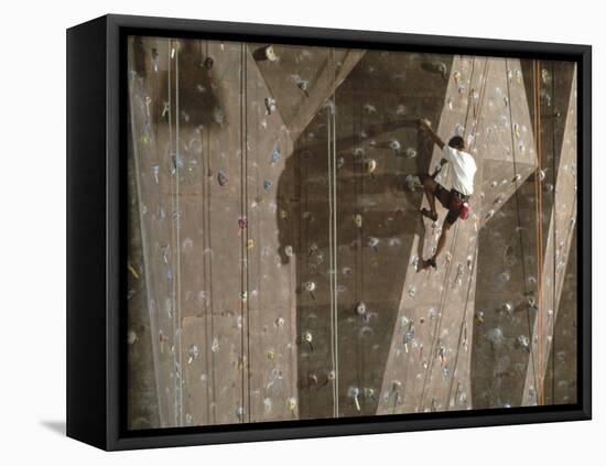 Man Wall Climbing Indoors with Equipment-null-Framed Premier Image Canvas