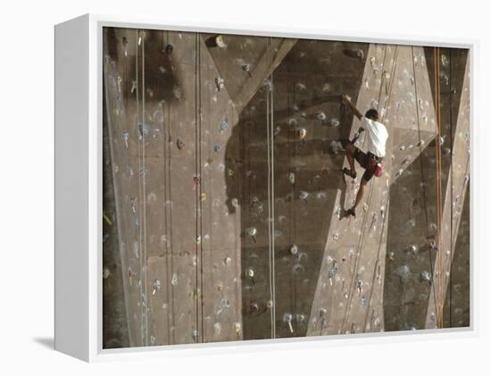 Man Wall Climbing Indoors with Equipment-null-Framed Premier Image Canvas