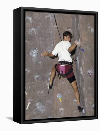 Man Wall Climbing Indoors with Equipment-null-Framed Premier Image Canvas