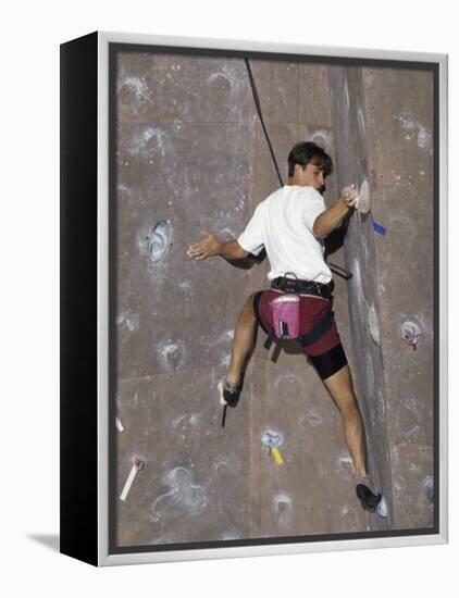 Man Wall Climbing Indoors with Equipment-null-Framed Premier Image Canvas