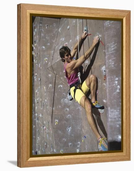 Man Wall Climbing Indoors-null-Framed Premier Image Canvas