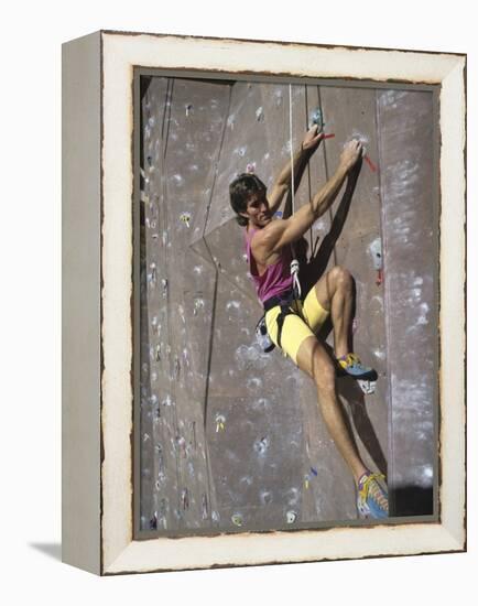 Man Wall Climbing Indoors-null-Framed Premier Image Canvas