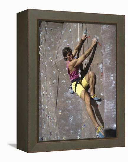 Man Wall Climbing Indoors-null-Framed Premier Image Canvas