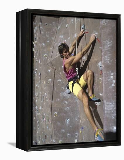 Man Wall Climbing Indoors-null-Framed Premier Image Canvas