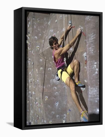 Man Wall Climbing Indoors-null-Framed Premier Image Canvas