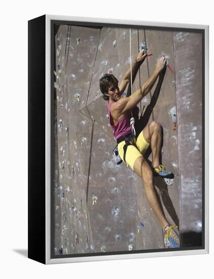 Man Wall Climbing Indoors-null-Framed Premier Image Canvas