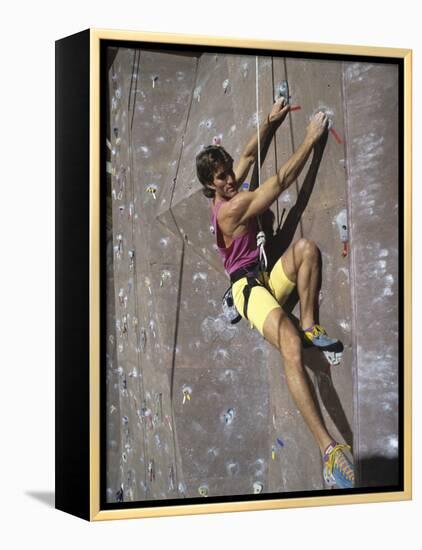 Man Wall Climbing Indoors-null-Framed Premier Image Canvas