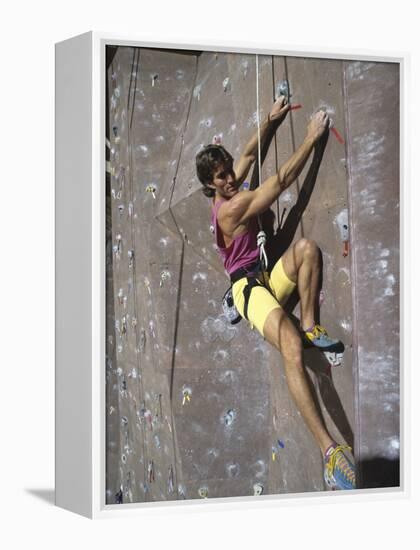 Man Wall Climbing Indoors-null-Framed Premier Image Canvas