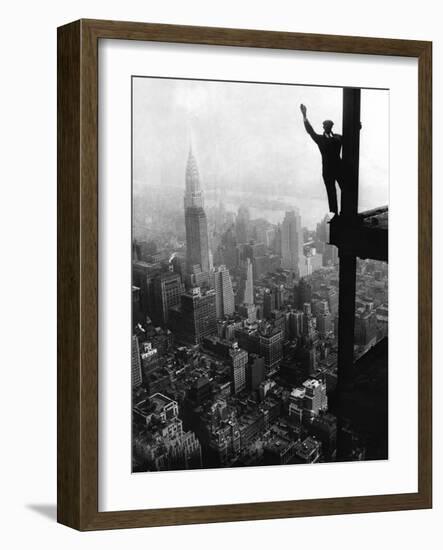 Man Waving from Empire State Building Construction Site--Framed Photographic Print