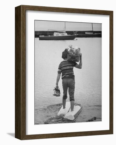 Man Wearing Aquaskins Which Enable Him to Walk on Water-Ralph Morse-Framed Photographic Print