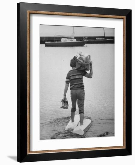 Man Wearing Aquaskins Which Enable Him to Walk on Water-Ralph Morse-Framed Photographic Print