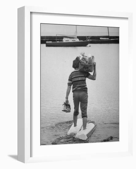 Man Wearing Aquaskins Which Enable Him to Walk on Water-Ralph Morse-Framed Photographic Print