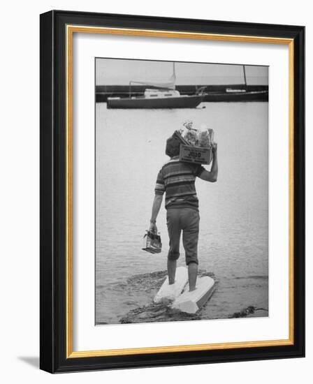 Man Wearing Aquaskins Which Enable Him to Walk on Water-Ralph Morse-Framed Photographic Print