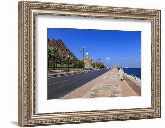 Man Wearing Dishdasha Walks Along Mutrah Corniche with National Flags, Middle East-Eleanor Scriven-Framed Photographic Print