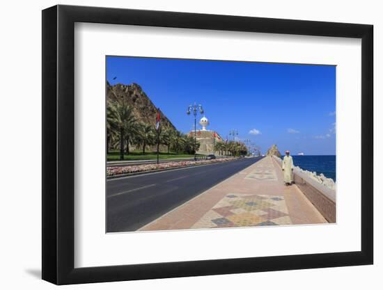 Man Wearing Dishdasha Walks Along Mutrah Corniche with National Flags, Middle East-Eleanor Scriven-Framed Photographic Print