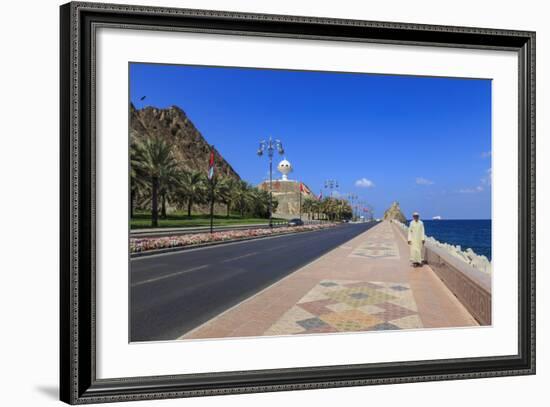 Man Wearing Dishdasha Walks Along Mutrah Corniche with National Flags, Middle East-Eleanor Scriven-Framed Photographic Print