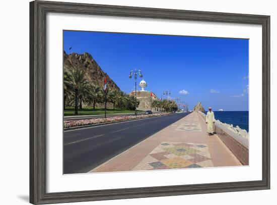 Man Wearing Dishdasha Walks Along Mutrah Corniche with National Flags, Middle East-Eleanor Scriven-Framed Photographic Print