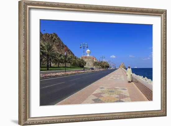 Man Wearing Dishdasha Walks Along Mutrah Corniche with National Flags, Middle East-Eleanor Scriven-Framed Photographic Print