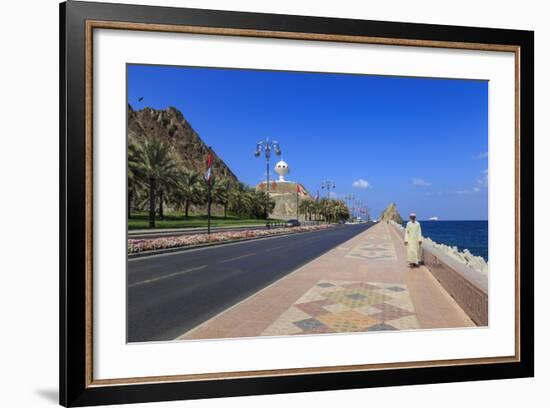 Man Wearing Dishdasha Walks Along Mutrah Corniche with National Flags, Middle East-Eleanor Scriven-Framed Photographic Print