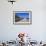 Man Wearing Dishdasha Walks Along Mutrah Corniche with National Flags, Middle East-Eleanor Scriven-Framed Photographic Print displayed on a wall