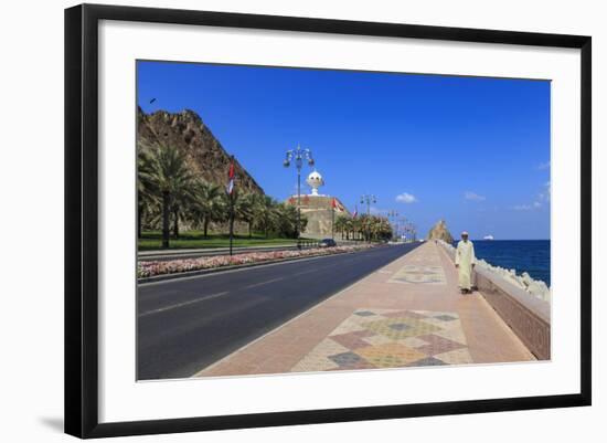 Man Wearing Dishdasha Walks Along Mutrah Corniche with National Flags, Middle East-Eleanor Scriven-Framed Photographic Print