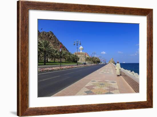 Man Wearing Dishdasha Walks Along Mutrah Corniche with National Flags, Middle East-Eleanor Scriven-Framed Photographic Print