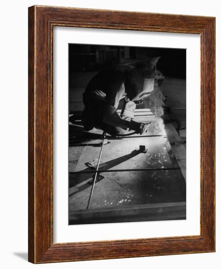 Man Welding Pieces of Metal Together-Allan Grant-Framed Photographic Print