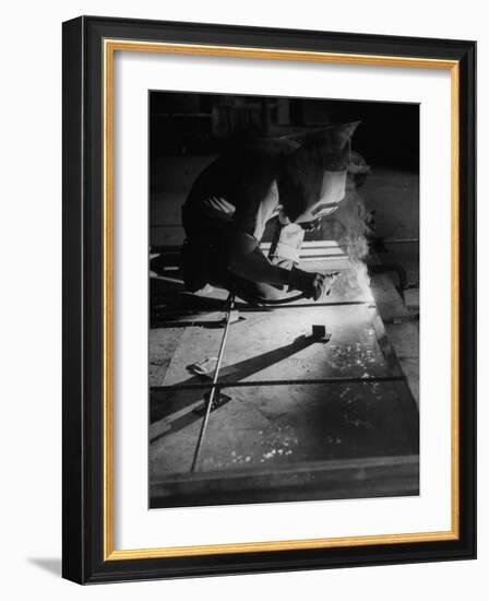 Man Welding Pieces of Metal Together-Allan Grant-Framed Photographic Print