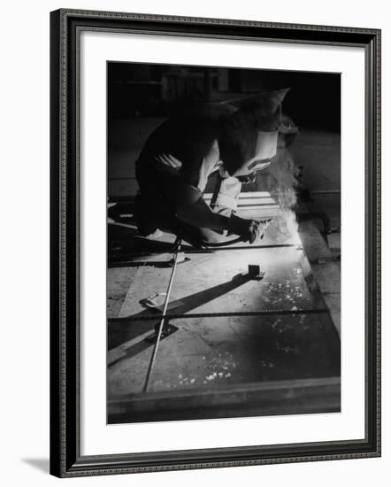 Man Welding Pieces of Metal Together-Allan Grant-Framed Photographic Print