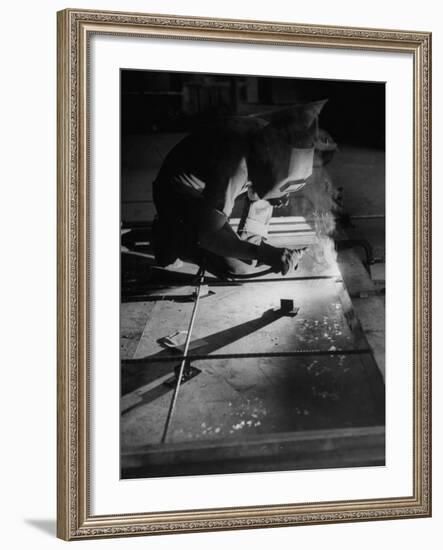 Man Welding Pieces of Metal Together-Allan Grant-Framed Photographic Print