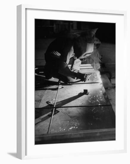 Man Welding Pieces of Metal Together-Allan Grant-Framed Photographic Print