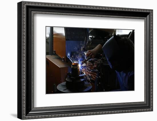 Man Welding Workpiece, Workshop, Flying Sparks-Fact-Framed Photographic Print