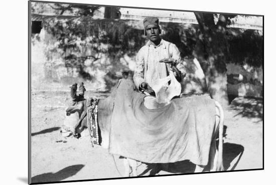 Man with a Deformed Cow, India, 1916-1917-null-Mounted Giclee Print