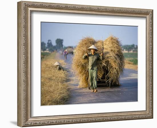 Man with Freshly Harvested Rice on Cart in the Ricefields of Bac Thai Province-Robert Francis-Framed Photographic Print