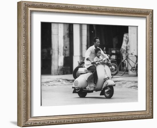 Man with His Son on Scooter-John Dominis-Framed Photographic Print