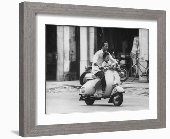 Man with His Son on Scooter-John Dominis-Framed Photographic Print