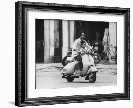 Man with His Son on Scooter-John Dominis-Framed Photographic Print