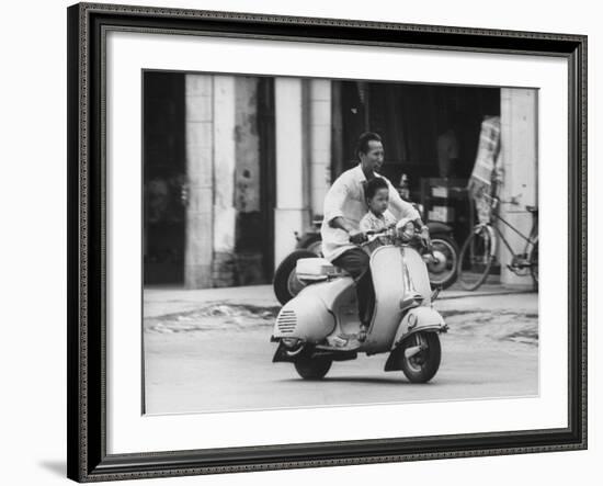 Man with His Son on Scooter-John Dominis-Framed Photographic Print