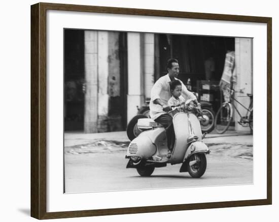 Man with His Son on Scooter-John Dominis-Framed Photographic Print