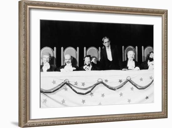 Man with Row of Seated Puppets-null-Framed Photo