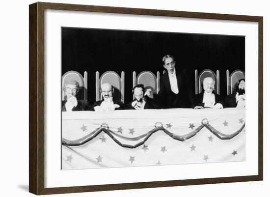 Man with Row of Seated Puppets-null-Framed Photo