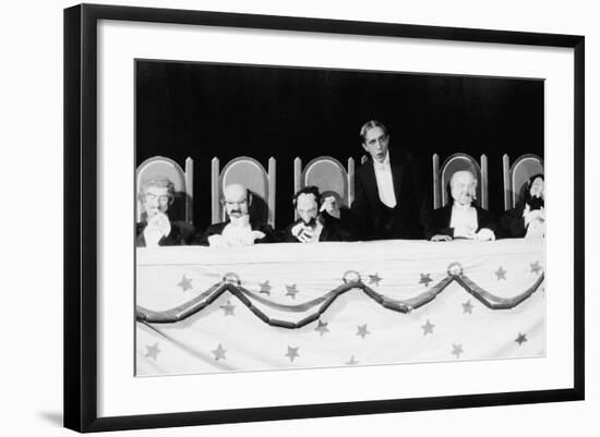 Man with Row of Seated Puppets-null-Framed Photo